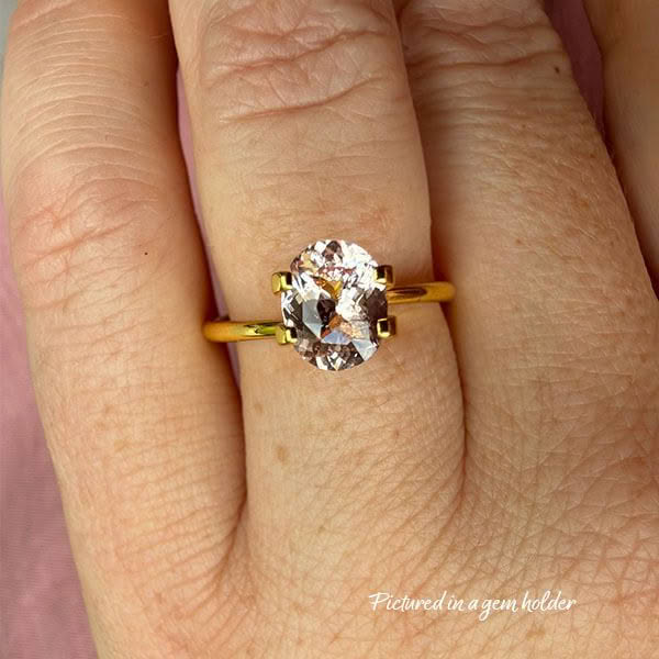 5. Pink-Padparadscha-Sapphire-stone-oval-shape-1.19 carats-C207-on hand-yellow gold